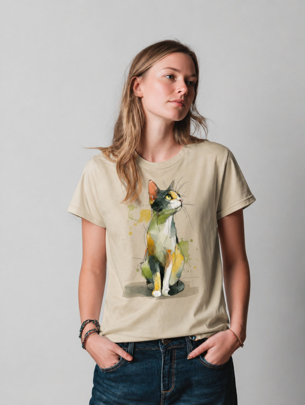 Person wearing a beigeWatercolor Cat graphic t-shirt featuring artistic cat artwork inspired by watercolor illustration and feline lovers.