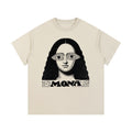 Beige Mona graphic t-shirt featuring artistic portrait-inspired artwork with a modern vintage aesthetic.