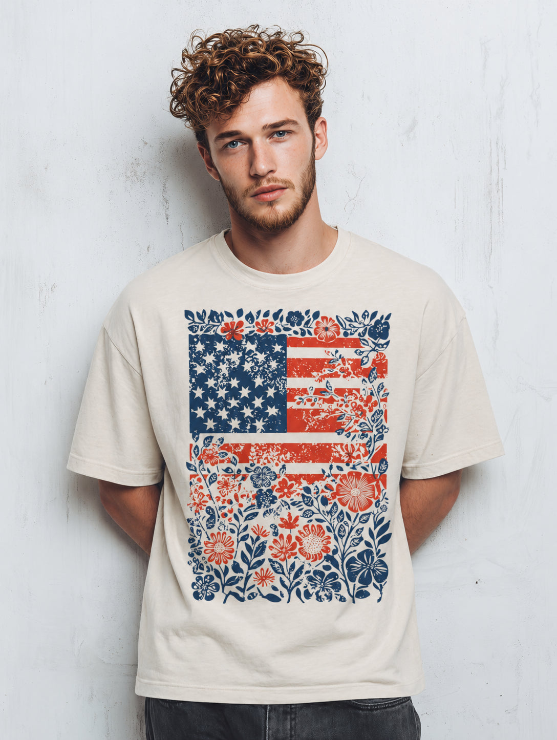 Man wearing a t-shirt with a floral American flag design against a white background