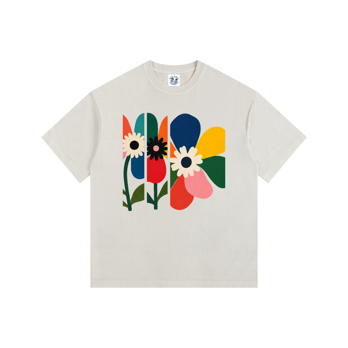 Light beige graphic T-shirt with colorful abstract flowers and bold geometric petals.