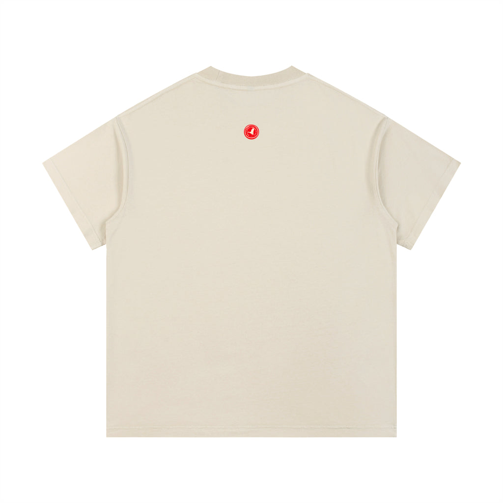 Beige t-shirt with a logo on the back against a white background