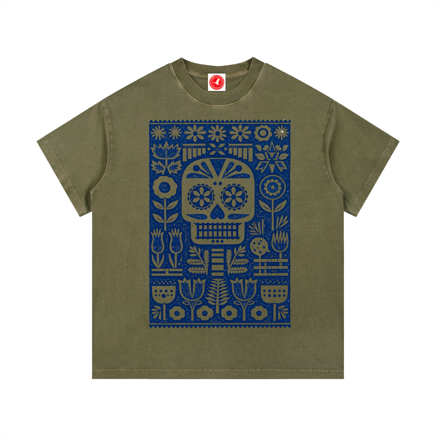 Green Folk Skull graphic t-shirt featuring decorative skull artwork inspired by folk art and vintage illustration.