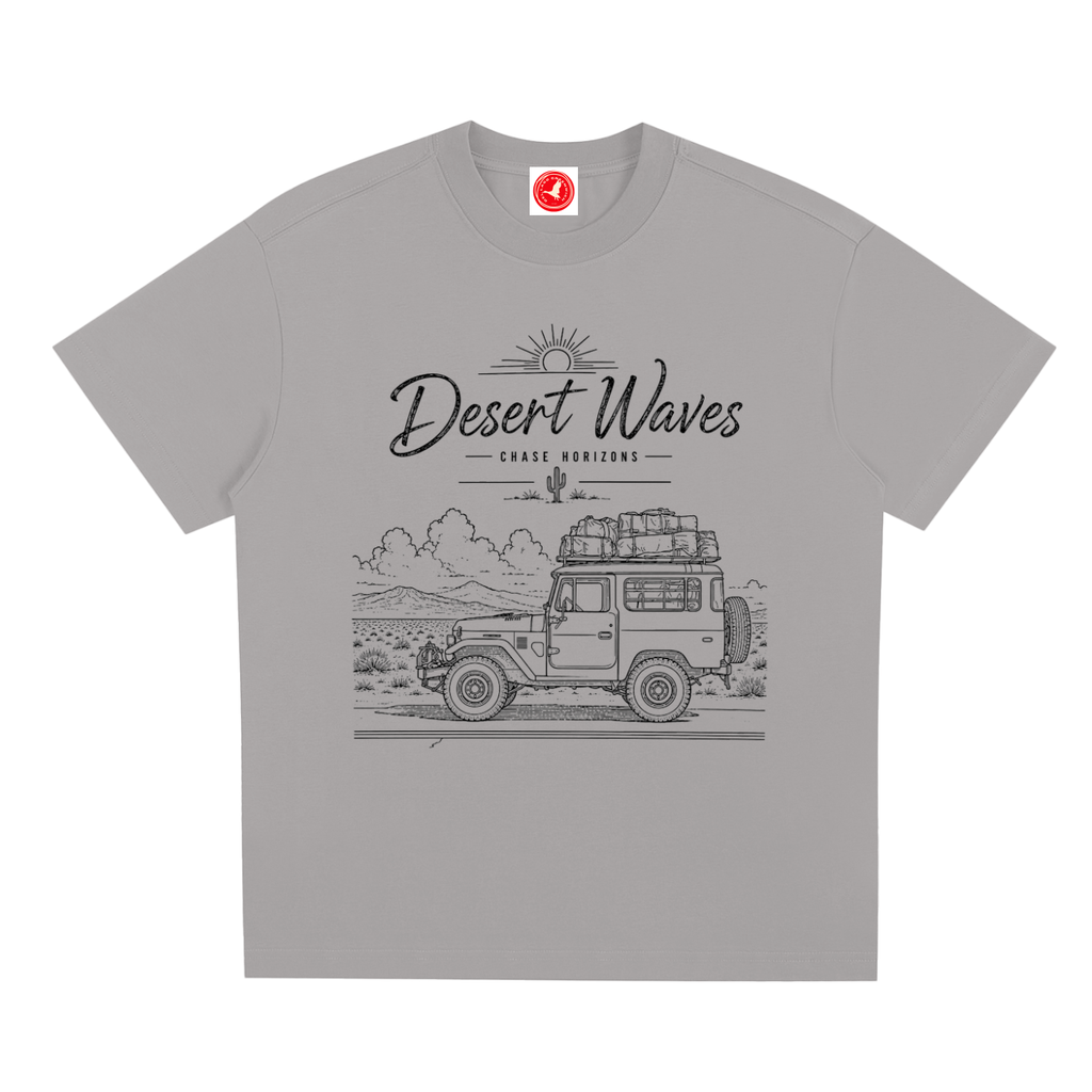 Gray Desert-inspired graphic t-shirt featuring artistic landscape artwork blending desert scenery with coastal influences.