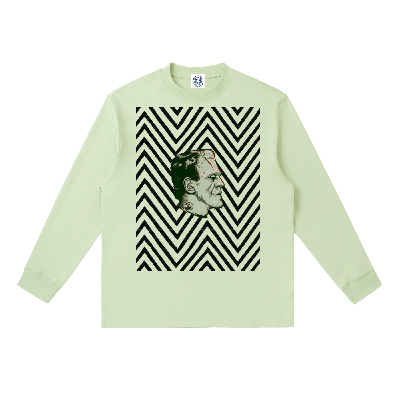 A pale green long-sleeve crewneck sweatshirt featuring a graphic print of a horror character's face set against a black and white chevron pattern on the chest.