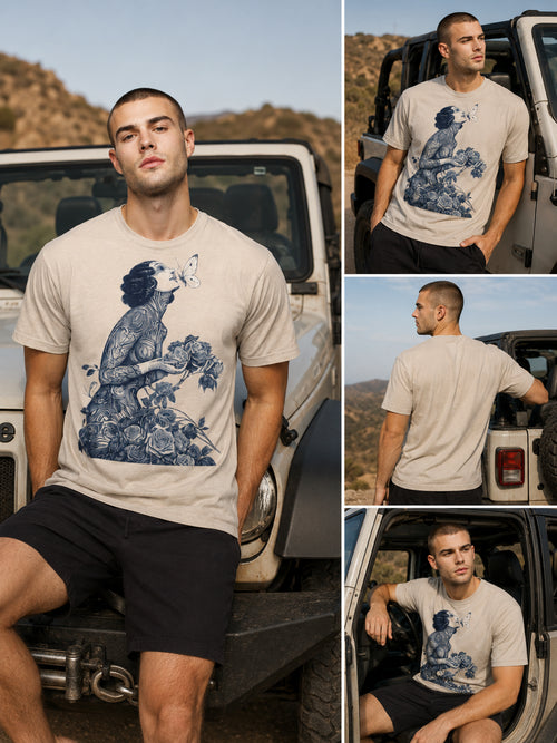 Man wearing a Botanical Muse graphic t-shirt featuring botanical artwork inspired by wildflowers and vintage illustration in front of a jeep.