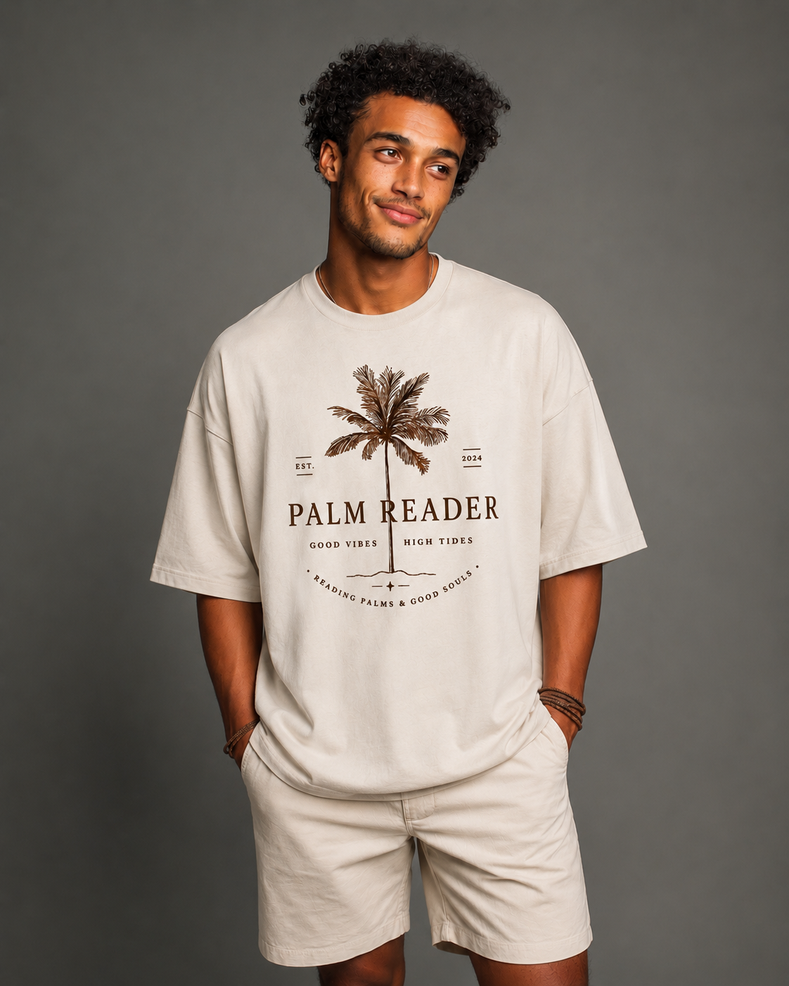 Palm Reader tee on a relaxed oversized fit with vintage coastal-inspired artwork and soft neutral tones — designed for laid-back days, open roads, and sun-faded moods.