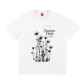 White Graphic t-shirt featuring sunset-inspired artwork celebrating relaxed coastal living and everyday adventure.