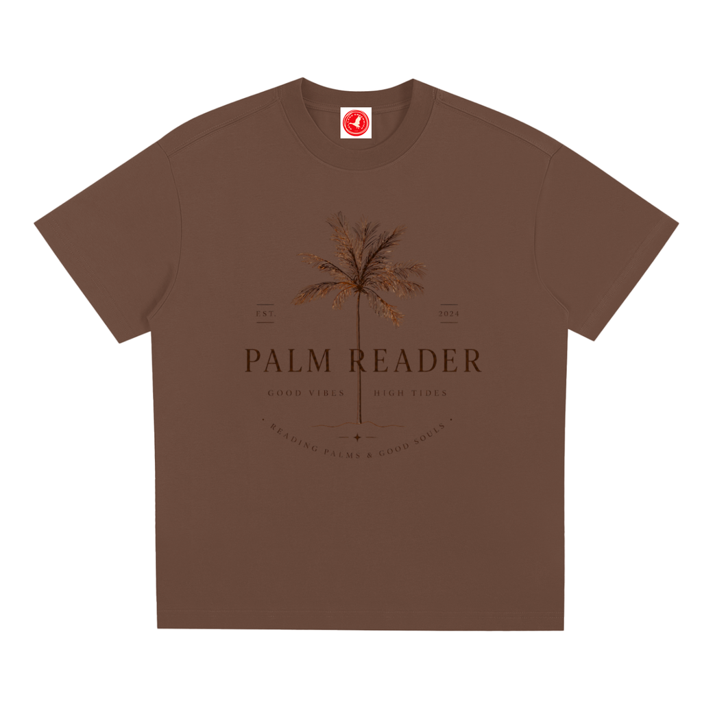 Brown Coastal graphic t-shirt featuring palm-themed artwork inspired by beach life, sunshine, and tropical escapes.