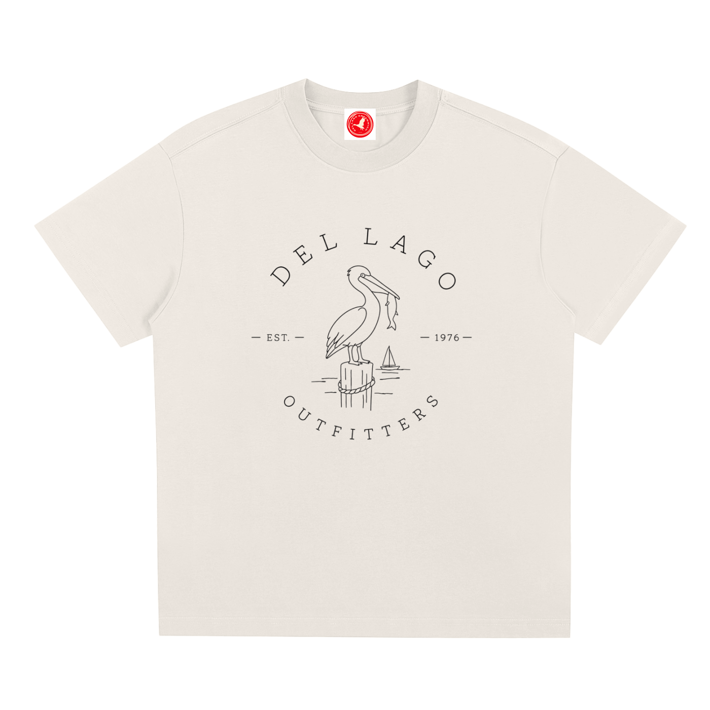 Beige Pelican graphic t-shirt featuring original coastal bird artwork inspired by beach living and nature.