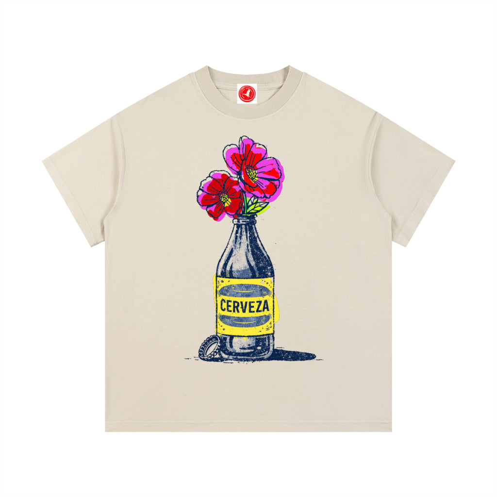 Beige Cerveza Bloom Bottle graphic t-shirt featuring floral bottle artwork inspired by vintage design and botanical illustration.